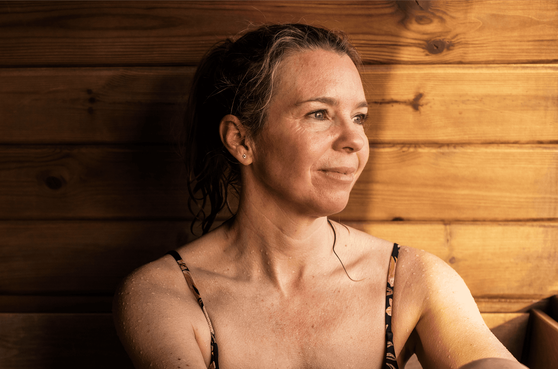 Woman sitting in sauna